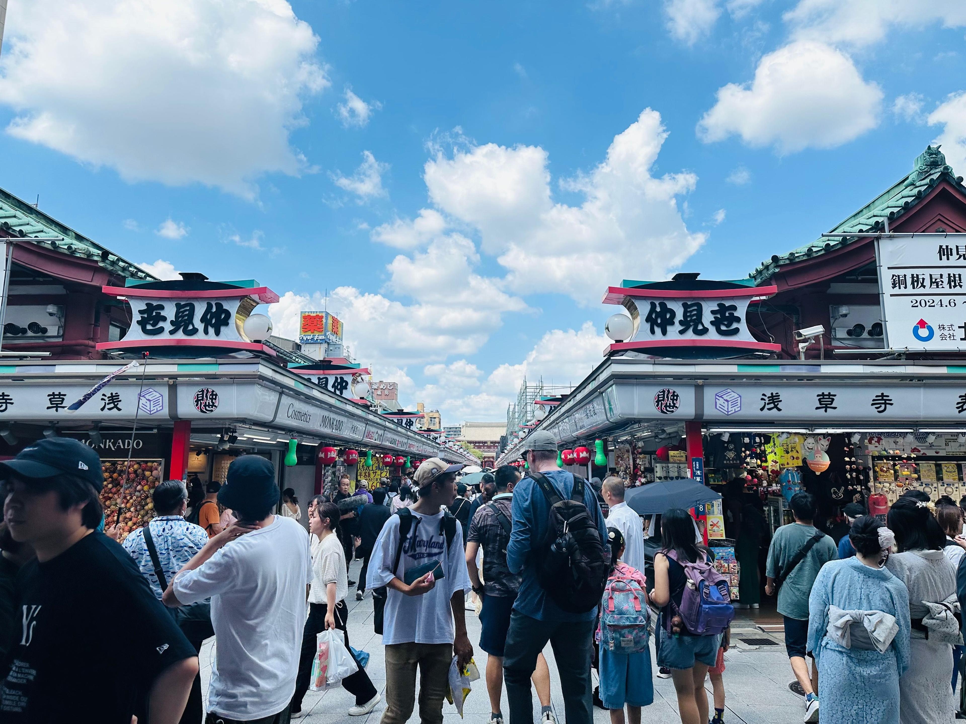 Visitors walking along Nakamise shopping street in Asakusa, Tokyo